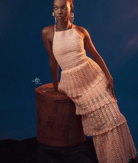 Tiered blush crochet maxi dress on model